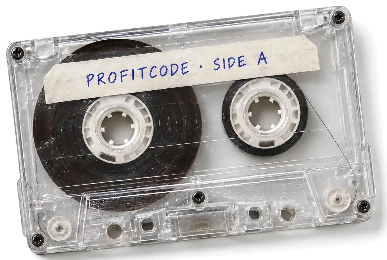 Прозрачная аудиокассета, на наклейке ручкой написано «Profitcode · Side A»
